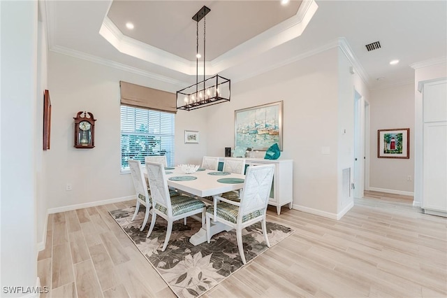 15951 Talon Ter, Punta Gorda, FL 33982 - dining space featuring visible vents, crown molding, light wood-type flooring, an inviting chandelier, and recessed lighting