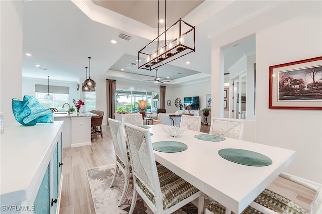 15951 Talon Ter, Punta Gorda, FL 33982 - dining area featuring light wood-style floors, a raised ceiling, recessed lighting, and visible vents