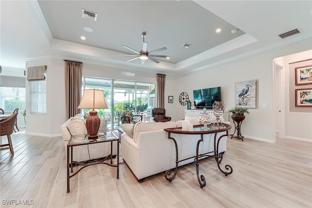 15951 Talon Ter, Punta Gorda, FL 33982 - living area featuring a ceiling fan, a tray ceiling, and visible vents