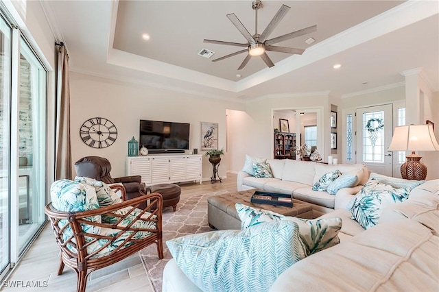 15951 Talon Ter, Punta Gorda, FL 33982 - living room featuring ceiling fan, visible vents, light wood-style floors, a tray ceiling, and recessed lighting