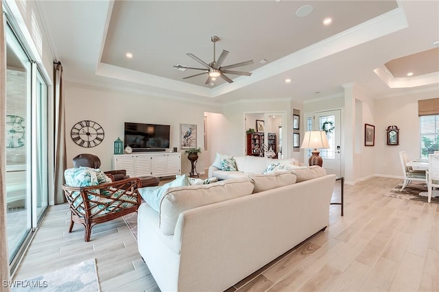 15951 Talon Ter, Punta Gorda, FL 33982 - living area with crown molding, light wood finished floors, a raised ceiling, recessed lighting, and a ceiling fan