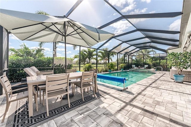 15951 Talon Ter, Punta Gorda, FL 33982 - view of swimming pool featuring a lanai, a patio, outdoor dining area, and a pool with connected hot tub