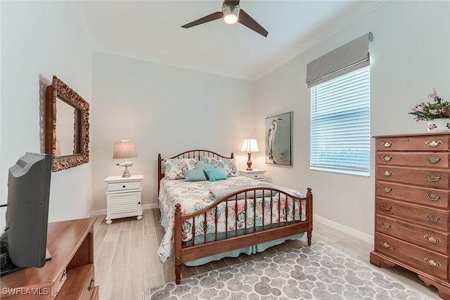 15951 Talon Ter, Punta Gorda, FL 33982 - bedroom with crown molding, baseboards, light wood finished floors, and ceiling fan
