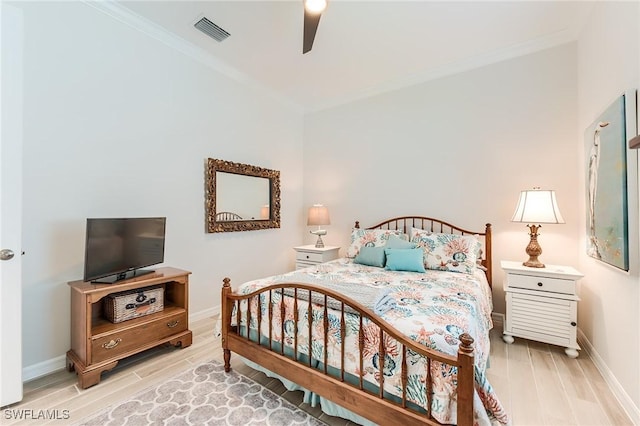 15951 Talon Ter, Punta Gorda, FL 33982 - bedroom featuring baseboards, ornamental molding, wood finished floors, and visible vents