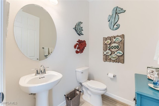 15951 Talon Ter, Punta Gorda, FL 33982 - half bath featuring baseboards, toilet, and wood finished floors