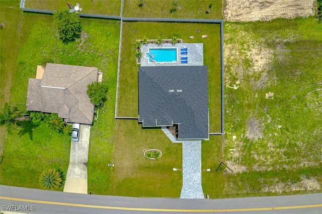 view from above of property featuring a pool area