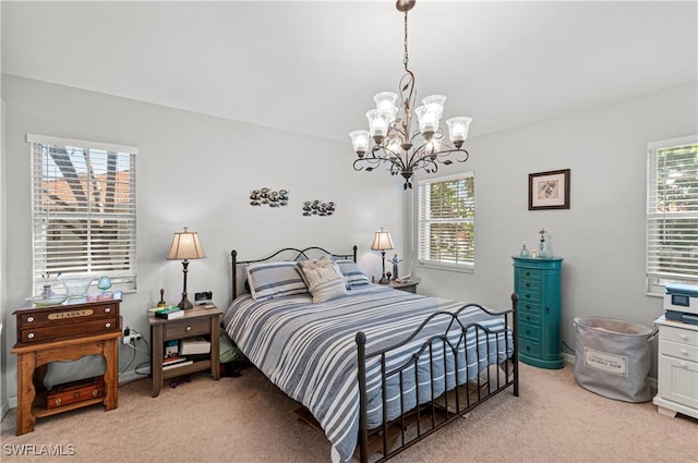 bedroom with light colored carpet, multiple windows, and a chandelier