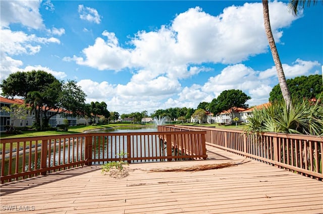 deck featuring a residential view and a water view