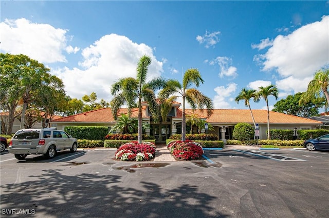 view of property with uncovered parking