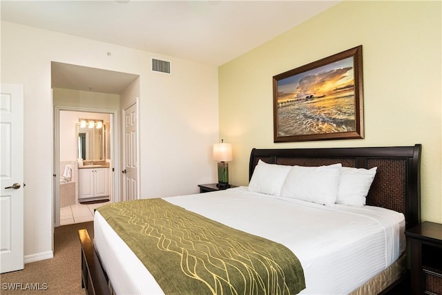 carpeted bedroom with connected bathroom