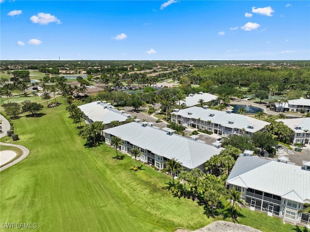 bird's eye view of a golf course and a large body of water
