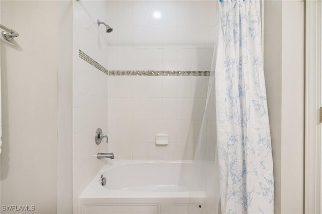 bathroom featuring shower / bath combination with curtain