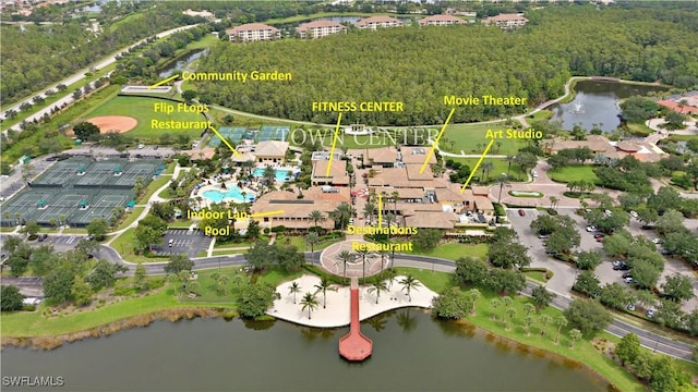 bird's eye view of a nearby body of water and a pool