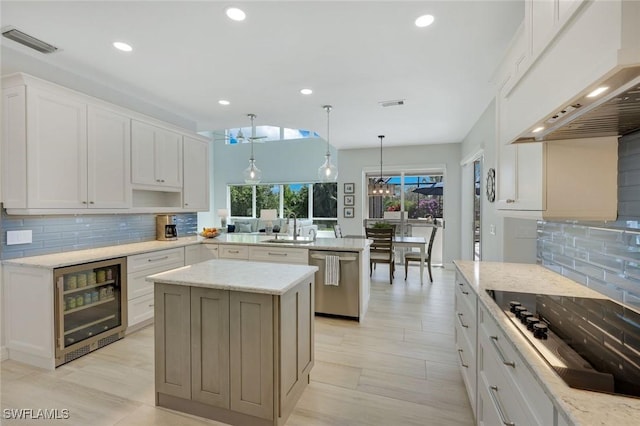 25011 Goldcrest Dr, Bonita Springs, FL 34134 - kitchen featuring beverage cooler, stainless steel dishwasher, black electric stovetop, a peninsula, and custom range hood