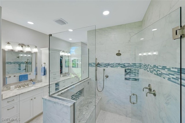 25011 Goldcrest Dr, Bonita Springs, FL 34134 - bathroom featuring recessed lighting, vanity, a stall shower, and visible vents