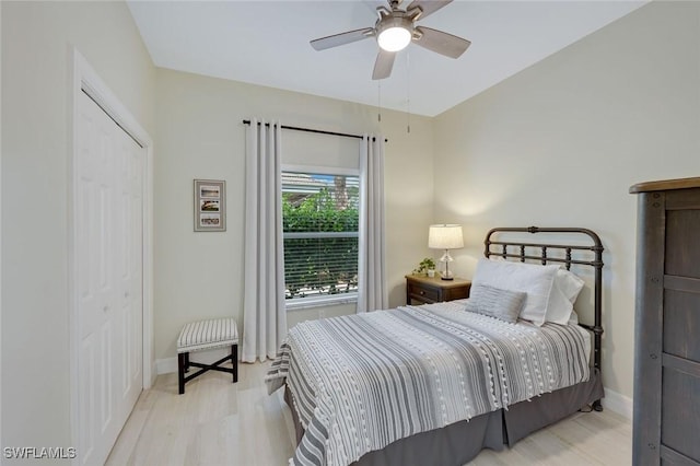 25011 Goldcrest Dr, Bonita Springs, FL 34134 - bedroom with wood finished floors, a closet, baseboards, and ceiling fan