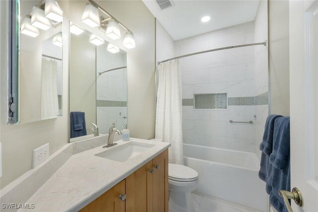 25011 Goldcrest Dr, Bonita Springs, FL 34134 - full bath with toilet, visible vents, recessed lighting, shower / bath combo with shower curtain, and vanity