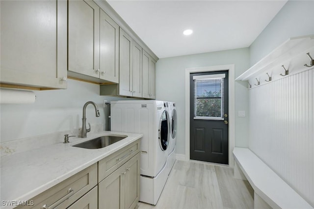 25011 Goldcrest Dr, Bonita Springs, FL 34134 - laundry room with recessed lighting, a sink, washing machine and clothes dryer, baseboards, and cabinet space