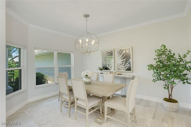 25011 Goldcrest Dr, Bonita Springs, FL 34134 - dining room with baseboards, ornamental molding, a chandelier, and light wood-style floors