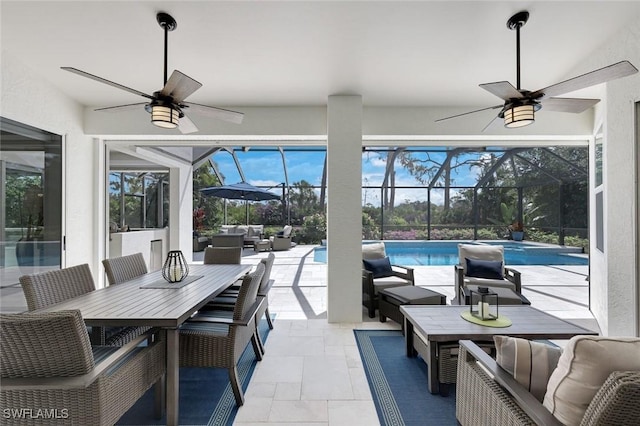 25011 Goldcrest Dr, Bonita Springs, FL 34134 - view of patio with an outdoor living space, a lanai, a ceiling fan, and outdoor dining area