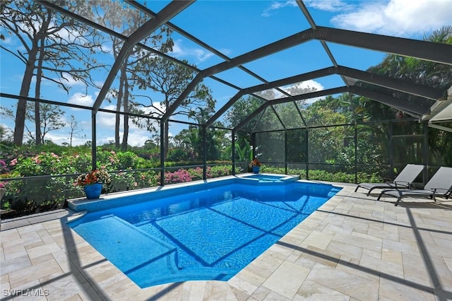 25011 Goldcrest Dr, Bonita Springs, FL 34134 - view of swimming pool with glass enclosure, a patio, and a pool with connected hot tub