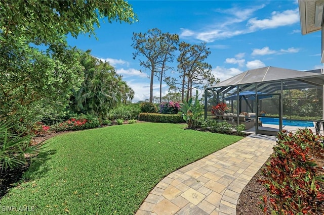 25011 Goldcrest Dr, Bonita Springs, FL 34134 - view of yard featuring an outdoor pool, a patio area, and glass enclosure