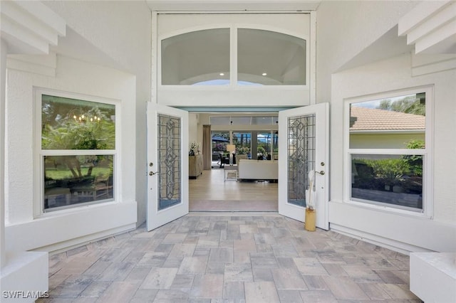 25011 Goldcrest Dr, Bonita Springs, FL 34134 - doorway to property featuring french doors and stucco siding