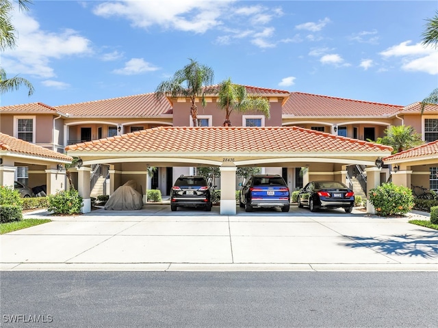 28436 Altessa Way Unit 102, Bonita Springs, FL 34135 - view of front of home with stucco siding, driveway, and a tile roof