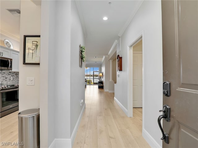 28436 Altessa Way Unit 102, Bonita Springs, FL 34135 - hallway featuring visible vents, ornamental molding, baseboards, light wood-type flooring, and recessed lighting