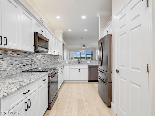 28436 Altessa Way Unit 102, Bonita Springs, FL 34135 - kitchen with decorative backsplash, crown molding, appliances with stainless steel finishes, white cabinets, and recessed lighting