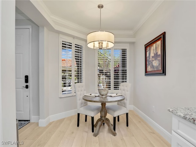 28436 Altessa Way Unit 102, Bonita Springs, FL 34135 - dining area with crown molding, baseboards, and light wood-type flooring
