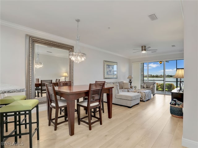 28436 Altessa Way Unit 102, Bonita Springs, FL 34135 - dining room featuring ornamental molding, ceiling fan with notable chandelier, light wood-style flooring, and visible vents