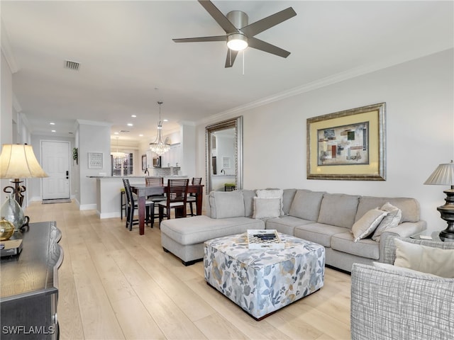 28436 Altessa Way Unit 102, Bonita Springs, FL 34135 - living room featuring crown molding, light wood-style flooring, ceiling fan with notable chandelier, recessed lighting, and visible vents