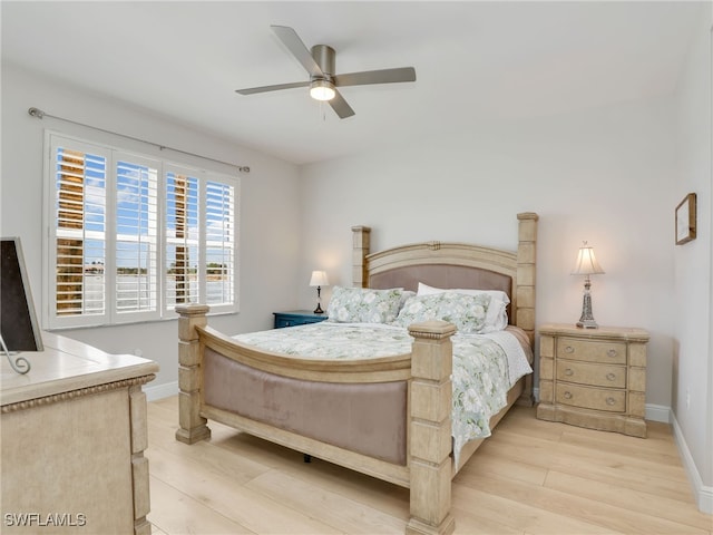 28436 Altessa Way Unit 102, Bonita Springs, FL 34135 - bedroom featuring baseboards, a ceiling fan, and light wood finished floors