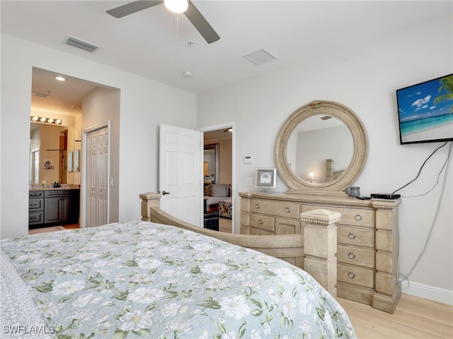 28436 Altessa Way Unit 102, Bonita Springs, FL 34135 - bedroom with baseboards, light wood finished floors, ensuite bath, and visible vents