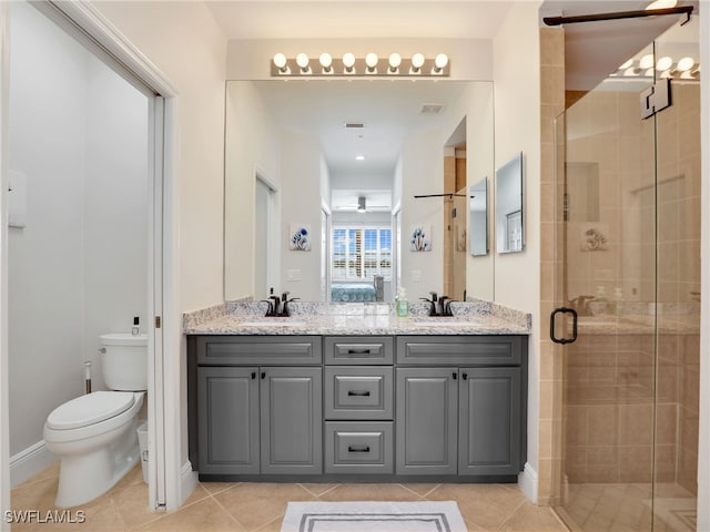 28436 Altessa Way Unit 102, Bonita Springs, FL 34135 - ensuite bathroom featuring toilet, a sink, and a stall shower