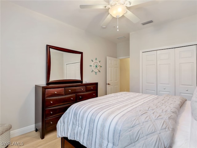 28436 Altessa Way Unit 102, Bonita Springs, FL 34135 - bedroom featuring visible vents, a closet, baseboards, a ceiling fan, and light wood finished floors