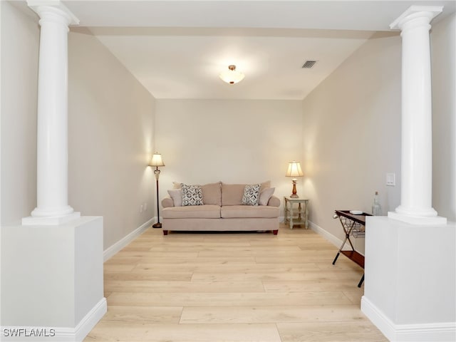 28436 Altessa Way Unit 102, Bonita Springs, FL 34135 - living room with light wood-style floors, baseboards, ornate columns, and visible vents