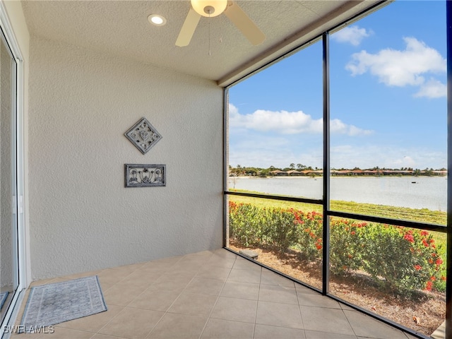 28436 Altessa Way Unit 102, Bonita Springs, FL 34135 - unfurnished sunroom with plenty of natural light, a water view, and ceiling fan