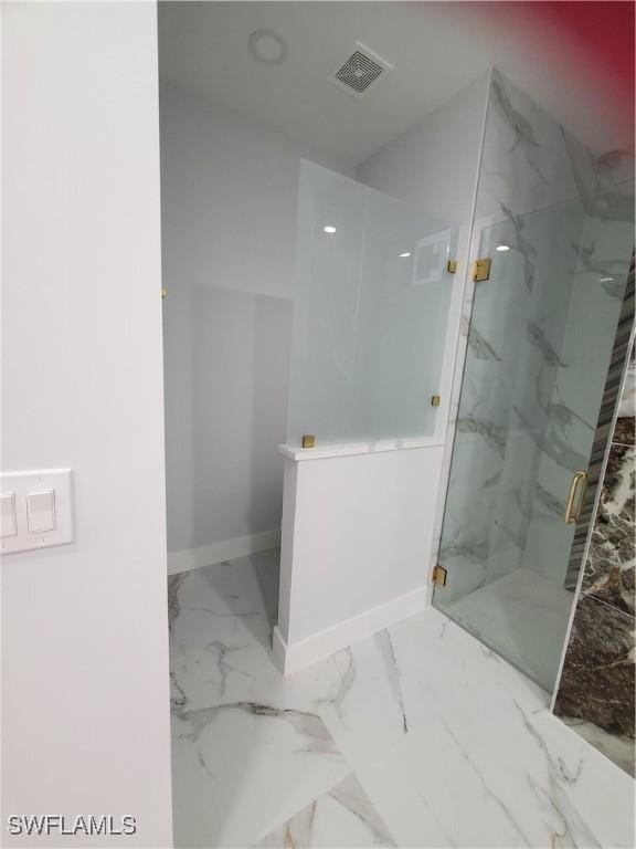 2012 Venice Ave N, Lehigh Acres, FL 33971 - bathroom with visible vents, baseboards, marble finish floor, and a marble finish shower