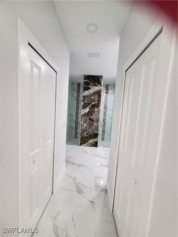 2012 Venice Ave N, Lehigh Acres, FL 33971 - hallway with marble finish floor