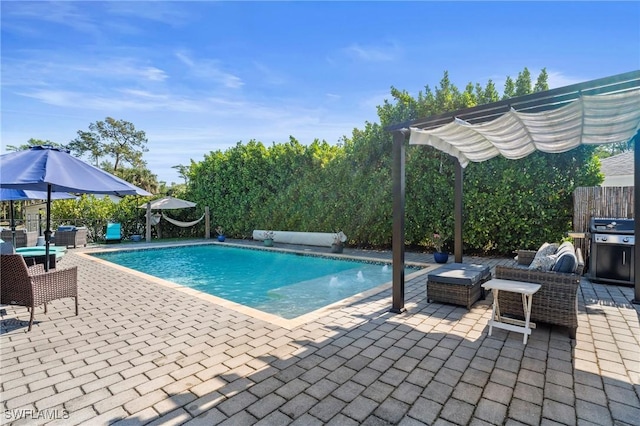 view of pool featuring fence, grilling area, a patio, and a fenced in pool