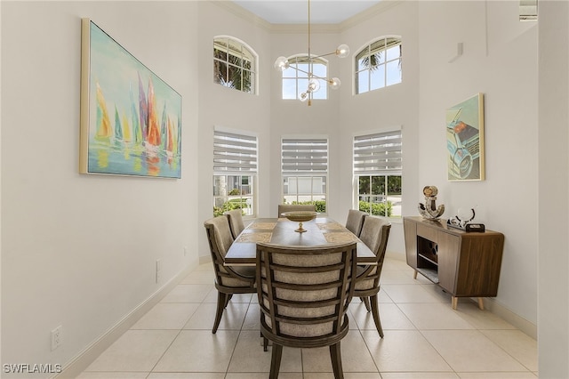 42 Tahiti Rd, Marco Island, FL 34145 - dining room with a chandelier, a healthy amount of sunlight, baseboards, and ornamental molding