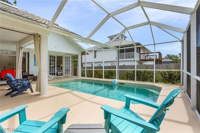 42 Tahiti Rd, Marco Island, FL 34145 - view of swimming pool with a patio area, a fenced in pool, a lanai, and fence