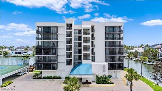 10420 Gulf Shore Dr Unit 132, Naples, FL 34108 - view of property featuring uncovered parking and a water view