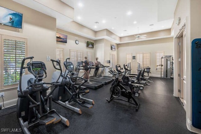 workout area featuring baseboards, a ceiling fan, and recessed lighting