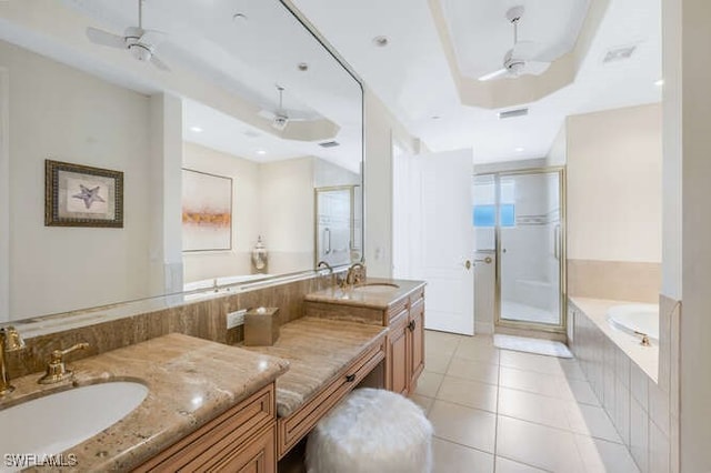 full bathroom featuring tile patterned floors, a sink, ceiling fan, and a stall shower