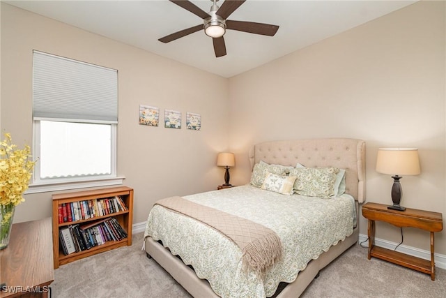bedroom featuring baseboards, ceiling fan, and carpet floors