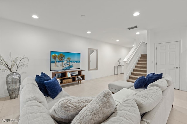 12109 Palm Cove St, Fort Myers, FL 33913 - living room with stairway, light tile patterned flooring, visible vents, and recessed lighting
