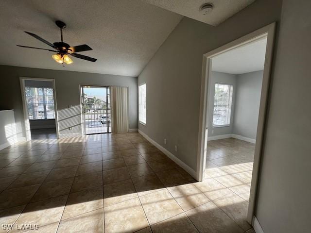 142 Santa Clara Dr Unit 7, Naples, FL 34104 - empty room with baseboards, ceiling fan, and a wealth of natural light